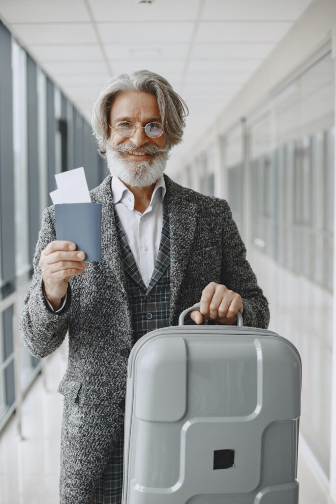 senior man with luggage